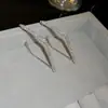 Pendientes colgantes de rombos con borlas tachonados de diamantes de aguja de plata transfronterizos europeos y americanos, pendientes exquisitos y de moda, pendientes versátiles y elegantes al por mayor