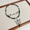 Nuevo collar con colgante de mariposa retro de estilo chino, accesorios para mujer, cadena de clavícula oscura de alta gama, dulce y genial collar apilado de doble capa.