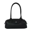 El popular bolso baguette de nicho de lujo de otoño, un diseño de alta gama, moderno y minimalista, perfecto para ir al trabajo y versátil para el uso diario como bolso de mano, bolso de hombro o bolso de axila