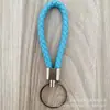 Llavero de cuerda de cuero trenzado simple creativo colgante de muñeca linda accesorios de llave para parejas tendencia regalos pequeños venta al por mayor