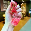Tiktok Garrafa de Cola que Brilha no Escuro Contas Coloridas Chaveiro que Brilha no Escuro Cheio de Óleo Lata de Abrir Fácil Areia Líquida Pequeno Pingente Brinquedo de Presente Ornamento