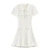Vestido de punto blanco pequeño y fragante nuevo clásico para primavera y verano con efecto adelgazante en la cintura y elegante hilo de diamante de línea A