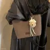 Bolso de mano retro de moda nuevo de gran capacidad para mujer 2026 otoño, bolso tote de un solo hombro con simple encanto coreano de cachorro