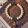 Pulsera de bodhi de frijol de leche de jade blanco natural de la montaña Putuo caja de estudiante pulsera de bodhi de loto de boj venta al por mayor de fábrica
