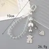 Ins Nuevo Colgante de Llavero con Lentejuelas y Lazo de Perlas para Funda de Teléfono Móvil Accesorios de Correa de Muñeca para Lanyard de Teléfono Móvil
