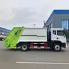 13. Camión de basura municipal hidráulico con caja de carga sellada para recoger y transportar residuos domésticos en zonas residenciales y calles