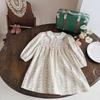 Ropa Importada para Niñas Vestido Estampado Ruched Estilo Francés Colección Primavera 2026 Dulce Vestido de Princesa con Cuello de Muñeca Manga Larga