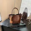 Bolsa de balde de cor sólida simples de moda transfronteiriça, grande capacidade, estilo preguiçoso, temperamento, para o trabalho, estilo coreano, nicho, de ombro único, transversal
