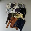 Artículos de alta calidad de una gran fábrica, artículos de alta gama de Shisanhang, Guangzhou, capa base Otoño/Invierno 2026, tonos tierra, top de tacto de alta gama para mujer