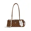 Bolso de axila de moda estilo coreano transfronterizo para mujer, nuevo bolso baguette de lunares con lazo, bolso de hombro y bolso de mano moderno y elegante