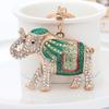 Llavero con forma de elefante de metal para coche, colgante con forma de elefante de color, estilo transfronterizo, al por mayor, con dibujos creativos para bolso de escuela.