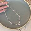 Collar de perlas de plata destrozadas de alta calidad para mujer, ligero, lujoso, con diseño de cadena de clavícula y accesorios que combinan con todo.