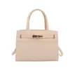 Nova bolsa de ombro da moda, bolsa de mão feminina simples e versátil, bolsa transversal Kelly nichada e única