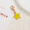 Llavero de pentagrama de aleación transfronterizo, colgante de cara sonriente colorida con cierre de langosta, accesorio decorativo para bolso estilo ins europeo y americano