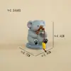 Atacado de itens decorativos para atrações turísticas: Artesanato em resina novo e criativo com animais de desenho animado e temas de pesca, adequado para decoração de casa e de mesa.