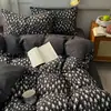 Atacado transfronteiriço de novos conjuntos de lençóis com estampas minimalistas de tema escuro em fio puffy (quarteto)