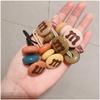 Versión coreana de color caramelo para mujer m frijoles atados goma para coleta cuerda para el pelo red popular simple cuerda para el pelo bola tocado de cuero venta al por mayor