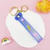 Llavero Colgante de Cordón de Cuero con Letra Transparente Brillante con Accesorios Estilo Muñeca Rellena de Aceite Encanto de Llavero Pulsera Venta al por Mayor