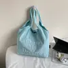 Bolsa de Lona Estilo Coreano Fashionável Estilo Preguiçoso com Letras para Mulheres 2025 Nova Bolsa Tote de Ombro Casual de Grande Capacidade para Trabalho