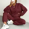 Conjunto de Duas Peças Outono e Inverno 2025 Novo Europeu e Americano Roupas Femininas Top de Gola Redonda com Mangas Longas e Padrão Trançado e Calça Leggings 9918