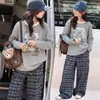 Ropa interior para niñas Otoño Manga larga 2026 Nueva camiseta Niños Estilo coreano Holgada Mediana y Grande Moda infantil Top de dibujos animados