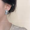 ¡Diablo! Aretes de flores de metal líquido de moda nicho viento frío aretes moda temperamento aretes ins