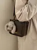 Bolso Versátil de Diseño de Nicho Elegante para Mujer Modelo Nuevo 2026 Alta Estética Ligero Simple para Viajar al Trabajo Bolso de Hombro Cruzado