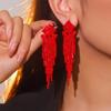 Pendientes largos con borlas rojas anticaídas y cinco explosiones navideñas negras para mujer, delicados y con gran sentido del humor.