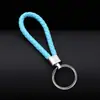 Llavero colgante de cuerda de cuero tejido de fábrica con cabeza de plástico para pareja, llavero de coche de cuero, colgante, accesorios, venta al por mayor