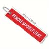 Nuevo llavero bordado transfronterizo de AliExpress, muy vendido, con cordón colgante bordado "REMOVER ANTES DEL VUELO".