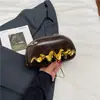 Bolso de mujer 2025 otoño nuevo modelo bolso de axila para ir al trabajo, bolso de hombro cruzado de diseño de nicho moderno y simple