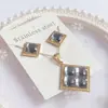 Nuevo especial transfronterizo explosión de tendencia europea y americana titanio acero alta calidad color collar pendientes traje femenino joyería de concha real