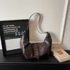 Bolso grande de mujer vintage para primavera y verano, nuevo modelo 2026, bandolera versátil para el día a día, bolso de hombro y axila de alta gama