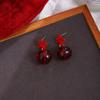 Pendientes de otoño e invierno con forma de corazón de melocotón y lazo rojo de Ancola, pequeños y ligeros pendientes de lujo de alta gama para Año Nuevo.