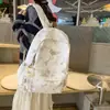 Nuevo modelo de comercio exterior mochila tie-dye INS para niñas, mochila ligera versión coreana para estudiantes de secundaria, mochila transfronteriza de gran capacidad