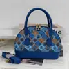 Bolso de concha de nicho estilo francés vintage para mujer, Nuevo de moda 2025 estilo Hong Kong material de retazos bolso de hombro y cruzado para mujer