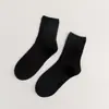 Meias novas femininas cor sólida algodão penteado japonês quatro estações meias cano alto preto e branco JK cor doce meias femininas simples atacado