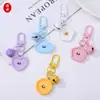 Llavero Colgante de Flor Geométrica de Resina con Cara Sonriente de Color Caramelo Forma de Corazón DIY Accesorio Creativo para Mochila Decoración