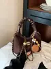 Bolso de diseño único para mujer, nueva colección otoño/invierno 2025, bolso de hombro retro casual, bolso tote y de axila versátil