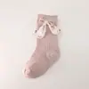 Meias para bebê menina primavera outono meias de cano médio para bebês agulha dupla laço meias de princesa para meninas meias infantis transfronteiriças Amazon