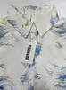 Camisa de mujer de estampado marmoleado europeo y americano transfronterizo, con cuello, adelgazante, ligera, resistente a las arrugas y favorecedora