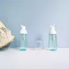 Botella cónica translúcida verde PET de 60 ml en stock, botella dispensadora de espuma para limpiador facial, botella dispensadora tipo prensa para pasta de dientes