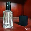 Nuevo Producto Botella Cuadrada de Vidrio Altamente Permeable Botella Transparente para Solución de Base Botella con Gotero para Aceite Esencial Subempaque Esencia Protector Solar