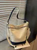 Bolsa estilo preguiçoso feminina 2026 nova bolsa de lona moda casual para trabalho deslocamento bolsa de ombro única bolsa transversal tipo balde