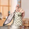 Monedero de lujo de alta calidad con colgante para auriculares, minibolso con llavero de lápiz labial, estilo vintage, con forma de cubo y boca roja, colgante sencillo.