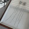 Pendientes de lujo ligeros de alta calidad con borlas de mariposa de estilo frío, largos, sin orejas, con clip para el hueso de la oreja, moda femenina, temperamento nuevo.