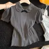 Top de punto trenzado color albaricoque con cuello de muñeca y manga corta para mujer, nuevo de verano 2026, ajuste ceñido, cintura estrecha, cuello vuelto, top corto