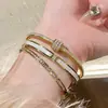 Pulsera de Tobillo para Uñas de Primavera 2024 Abierta para Mujer Acero de Titanio Temperamento Todo Fósforo Estilo Simple Trébol de Cuatro Hojas Forma de Corazón Uña