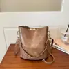Bolso pequeño vintage de alta calidad transfronterizo para mujer, nuevo bolso cruzado de moda otoño e invierno 2026, elegante bolso tipo cubo de nicho