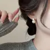 Corea del Sur pendientes de burbuja pequeña color champán para mujer 2024 nuevos pendientes simples de alto sentido temperamento joyería para orejas venta al por mayor